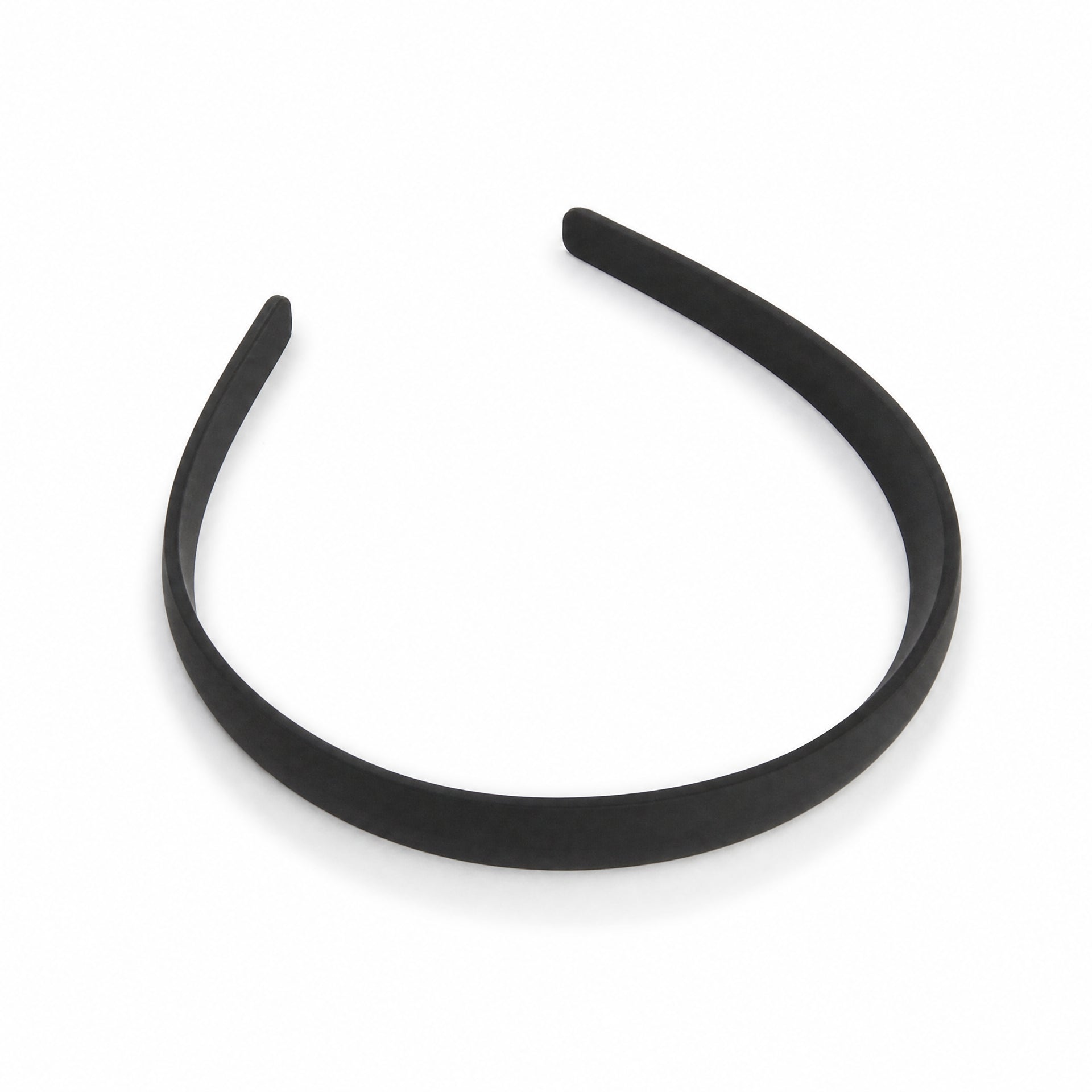 Diadema negra de una sola pieza con acabado liso y forma arqueada