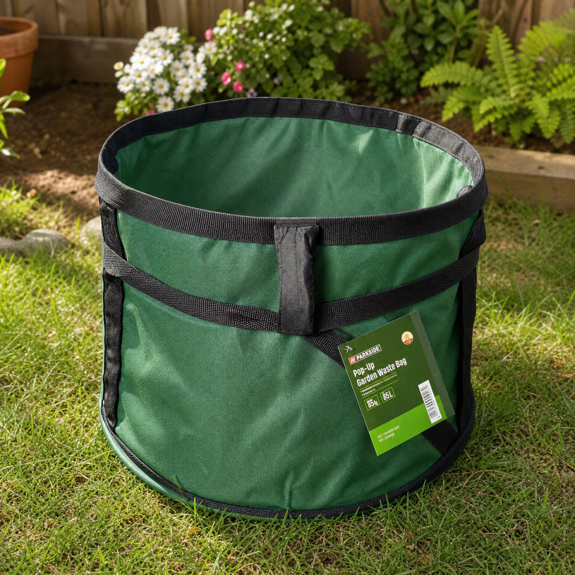 Bolsa plegable pop-up para residuos de jardín verde con asas negras y borde circular
