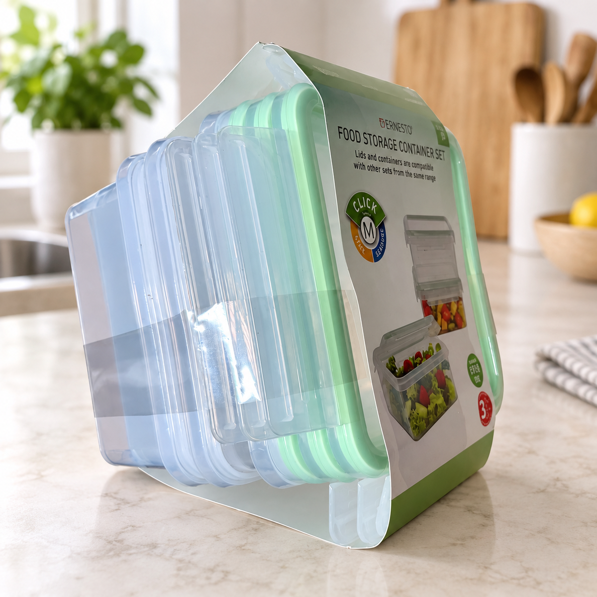 Un juego Ernesto Click M de tres recipientes con sus tapas verde menta y fajín sobre una encimera