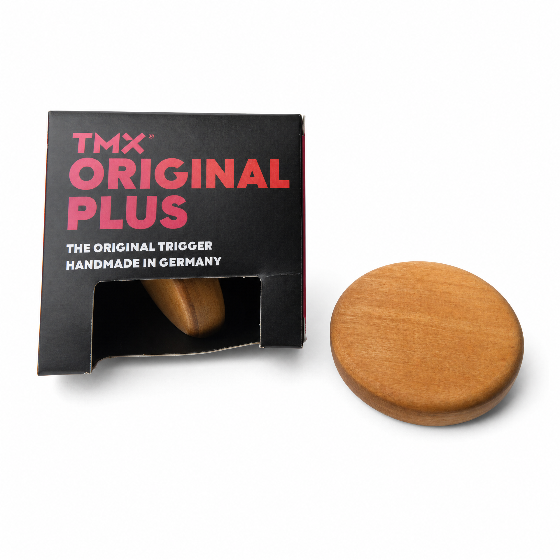 TMX — gatillo artesanal en caja con pieza de madera visible