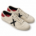 Vista principal de Zapatillas Munich Blancas de Lona con X Negra y Talón Rojo Unisex