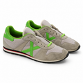 Zapatillas Munich Grises con X Verde Flúor Unisex - vista principal sobre fondo blanco