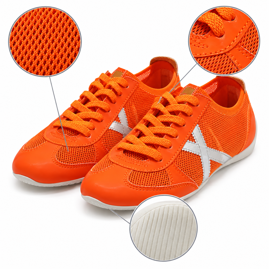 Características visuales de las zapatillas Munich naranjas con detalles plateados