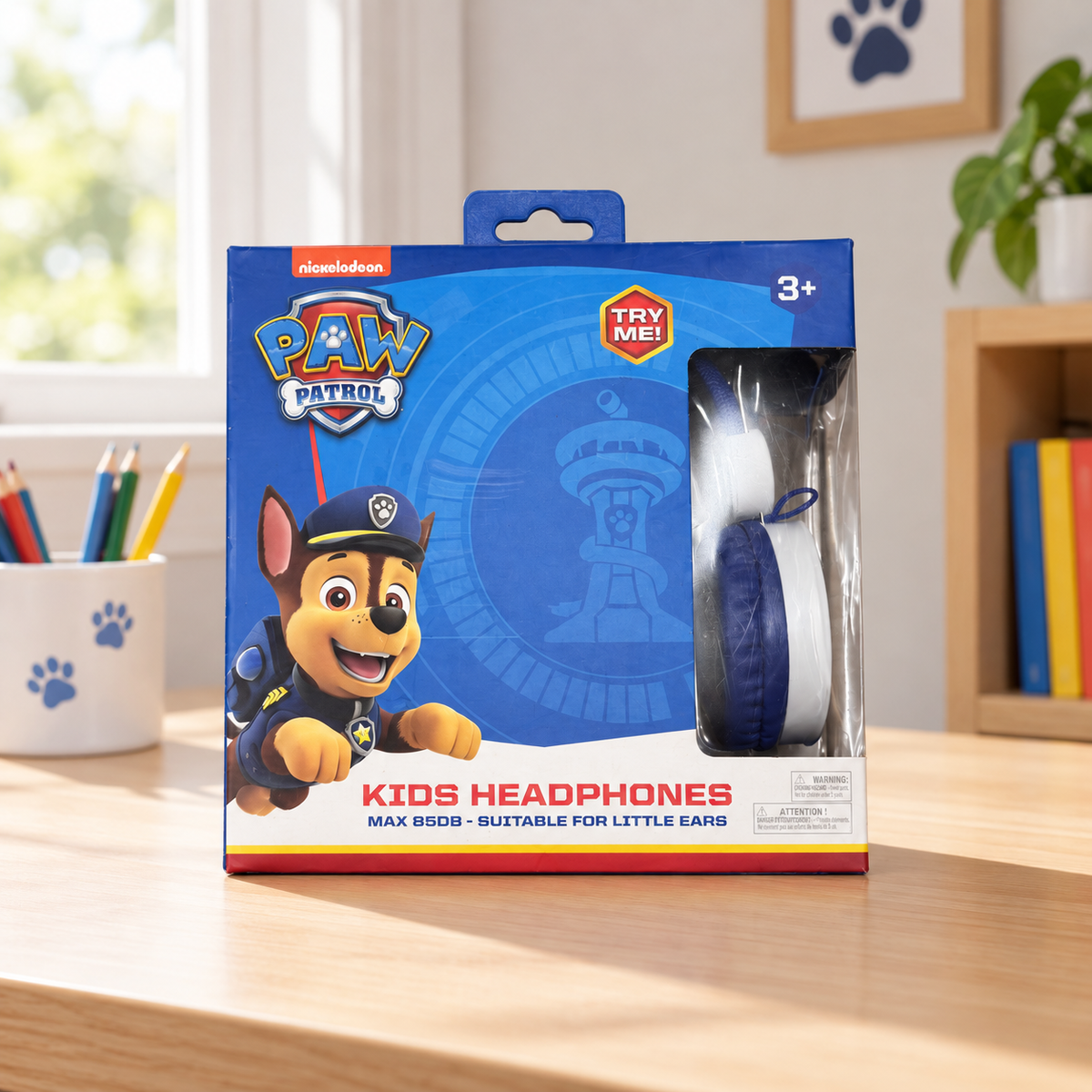 Auriculares infantiles Paw Patrol Chase en caja original sobre escritorio infantil