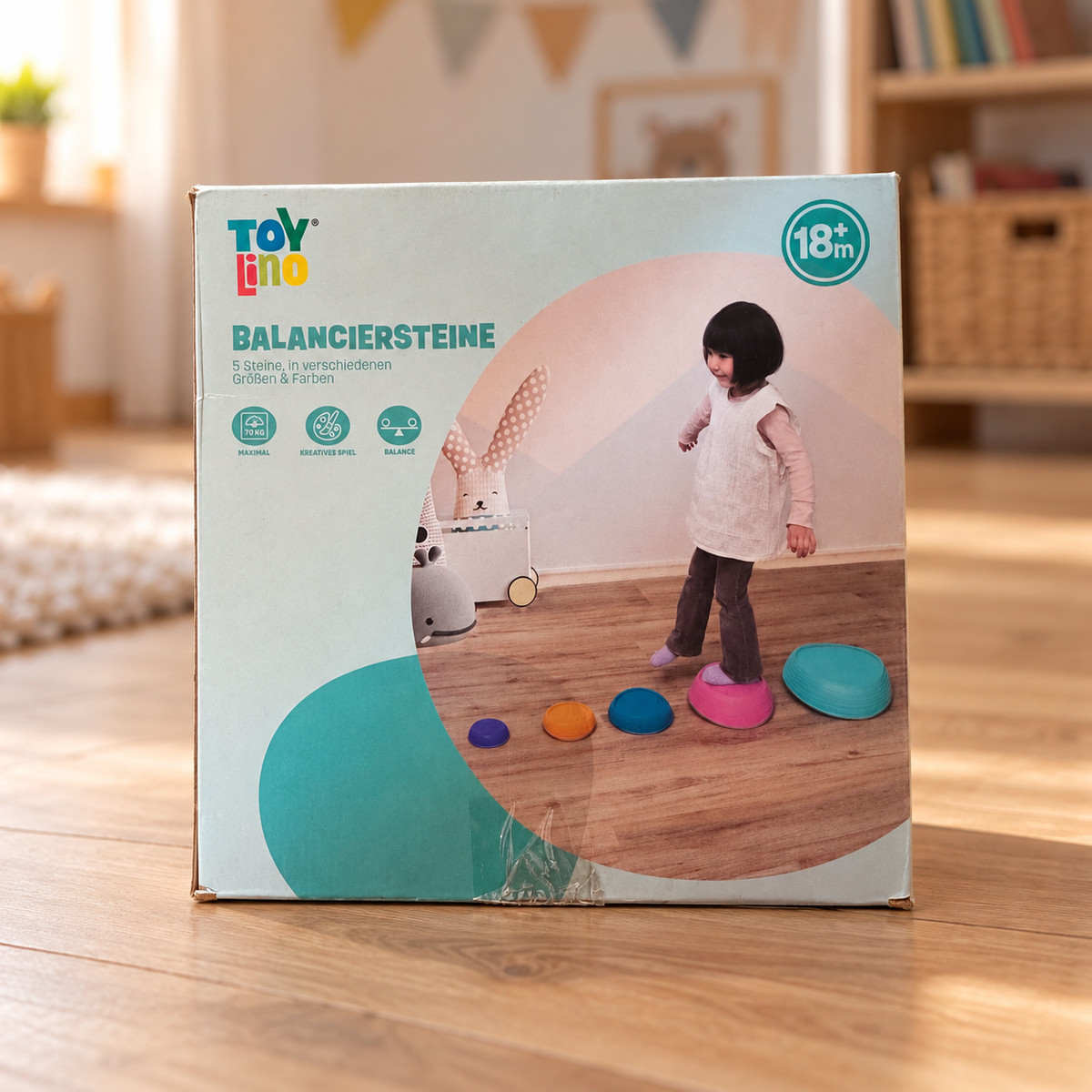 Caja Toy Lino de piedras de equilibrio en una habitación de juegos