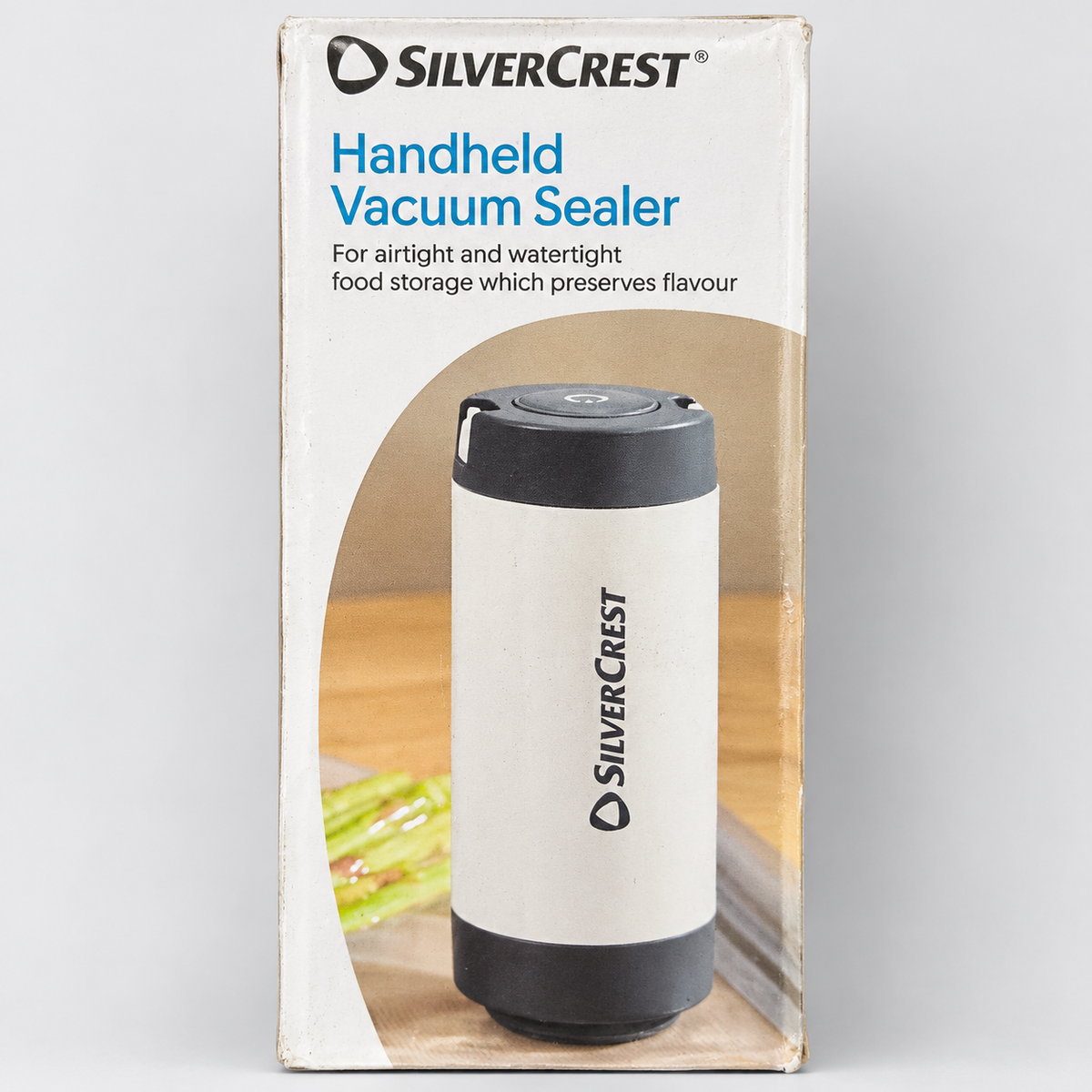 SilverCrest envasadora al vacío portátil en su embalaje con marcas visibles